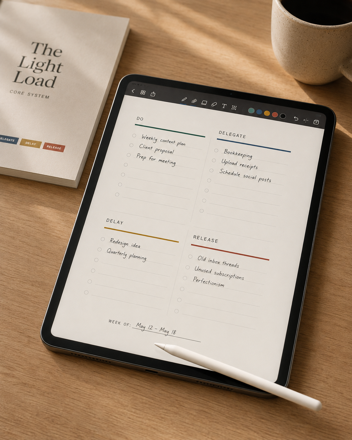 The Light Load Core System workbook and tablet showing the four-column weekly page